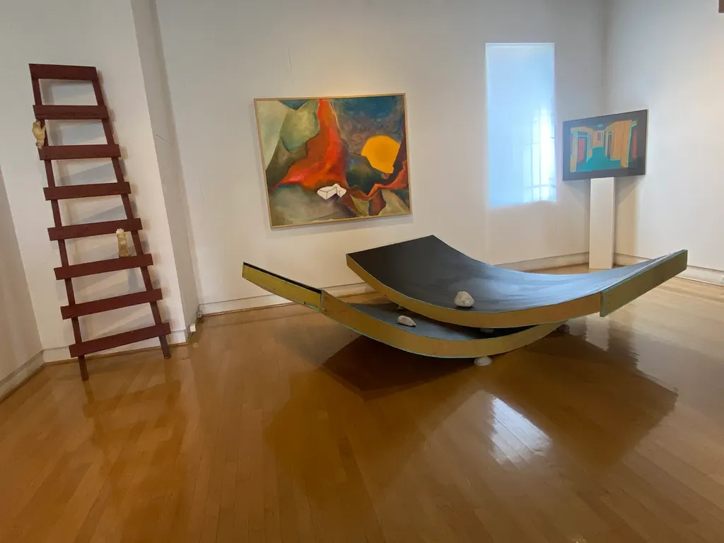 Sculptures and paintings in the west gallery space.