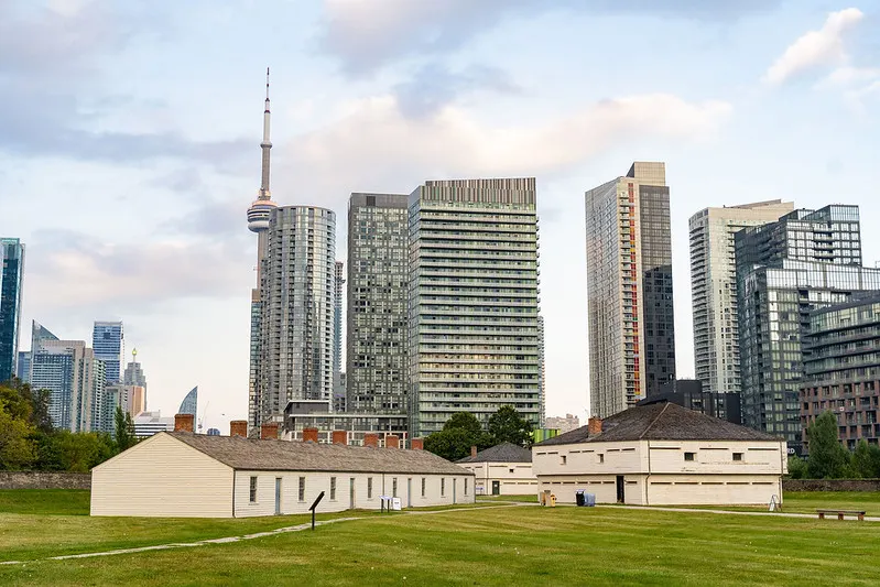 View of historic buildings at Fort York with CN Tower and other buildings in the background