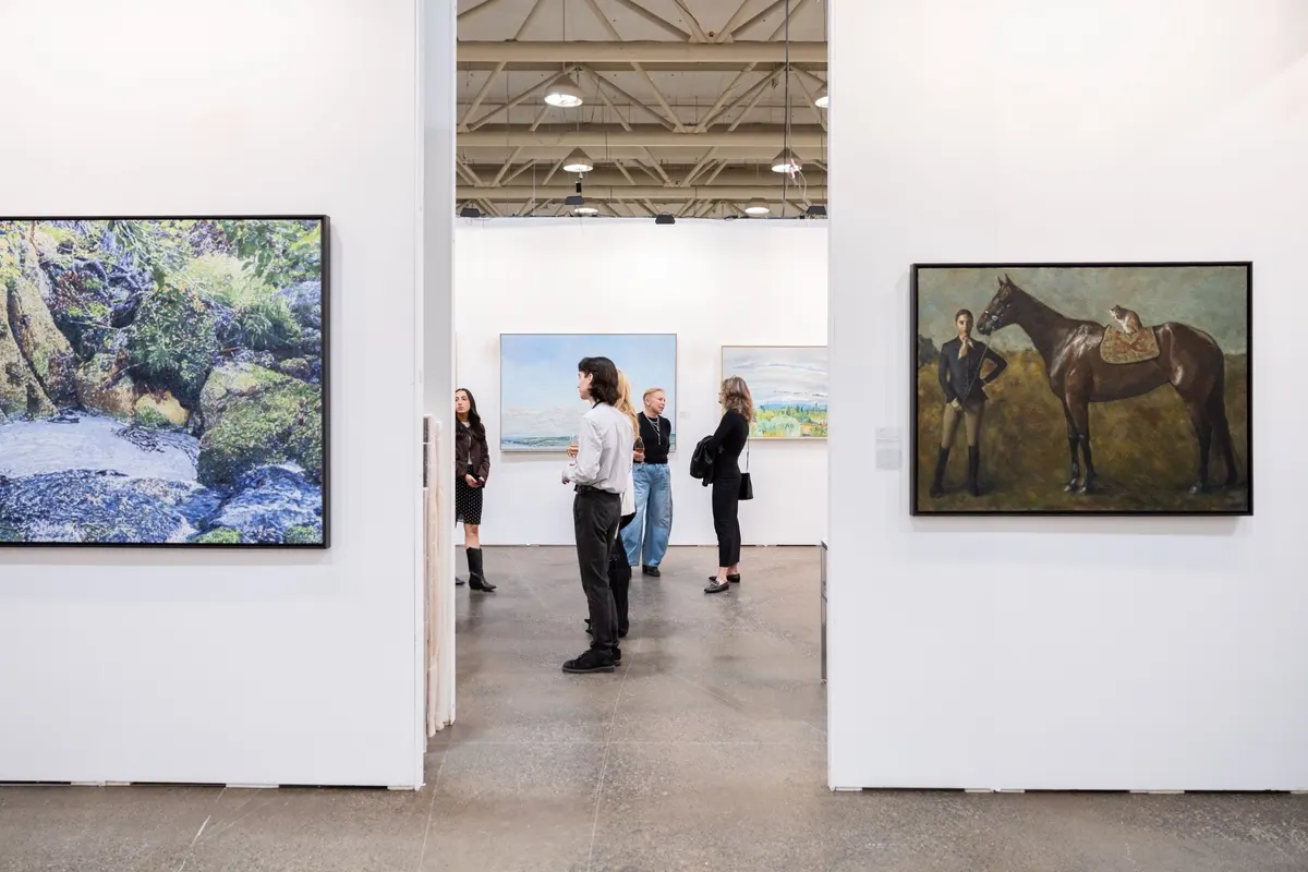 Gallery floor with paintings on display