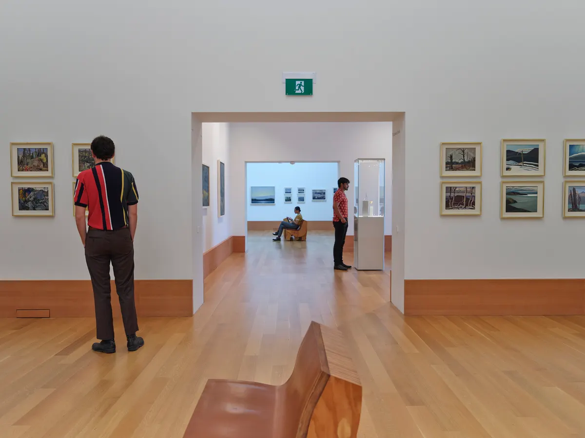 people looking at art