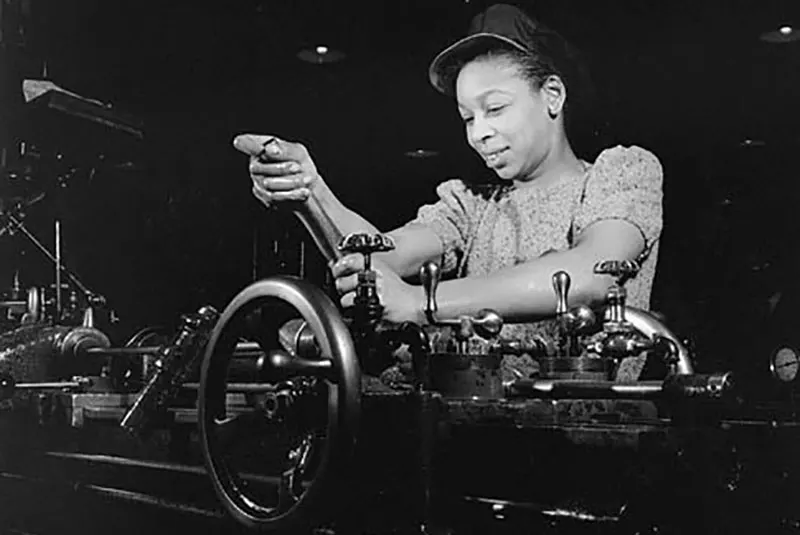 A female factory worker assembly parts in in the John Inglis Factory during WW2.