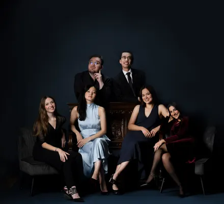 A group of young musicians pose together.