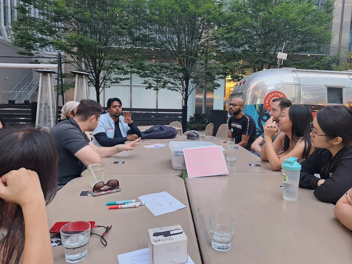 People sit around a table discussing